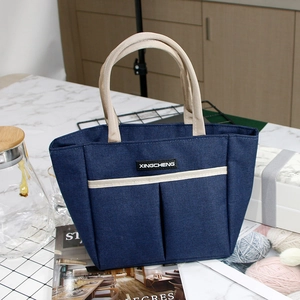 Grand sac isotherme en toile bleu foncé avec poignées robustes et poches extérieures