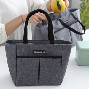 Grand sac à lunch isotherme gris foncé avec poignées noires et poches frontales