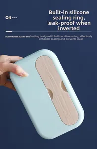Detail of mint green lunch box lid featuring wood grain pattern and silicone seal ring