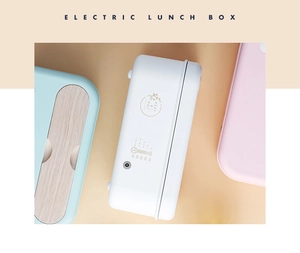 Vue macro de lunch boxes électriques en blanc, rose et vert menthe avec échelle thermique