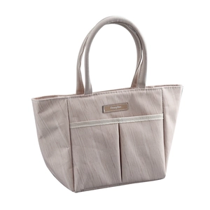 Pink minimalist lunch bag with wood grain details and front pockets for travel