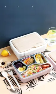 Detail of 4-compartment stainless steel lunch box with wood texture lid and cutlery