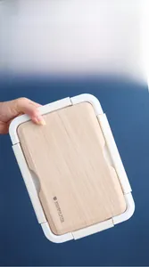 Detailed view of white lunch box with wood-style lid showing leak-proof silicone seal