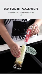 Detail of long-handle retractable cleaning brush with fiber bristles washing a glass cup