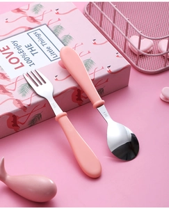 Detail of pink 304 stainless steel fork and spoon set with matte finish for kids