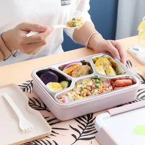 Pink four-compartment stainless steel bento box with matching lid, spoon and fork set