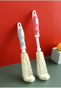 L-shaped bottle brushes in pink and green with ergonomic handles for deep cleaning