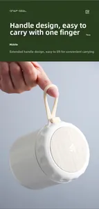Detail of portable breakfast cup featuring a flexible carry strap and wood grain lid design