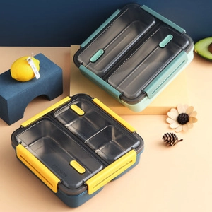 Detail view of divided stainless steel bento lunch box with secure dual-color side buckles