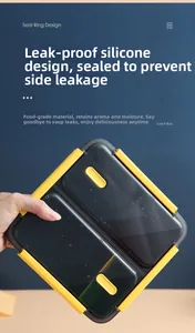 Detail of leak-proof silicone seal and secure side buckles on a yellow bento lunch box
