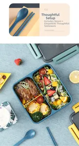 Three-compartment blue bento box with matching utensils showing meal prep organization