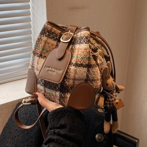 Chic plaid bucket bag in wool fabric with leather trim and cute rabbit charm detail