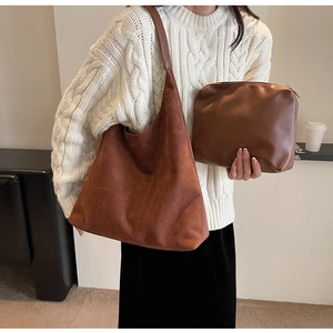 Detail of hobo tote set in brown suede texture with matching inner zipper pouch