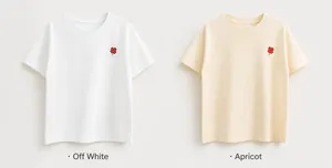 Detail of cotton T-shirts in off-white and apricot with red floral embroidery