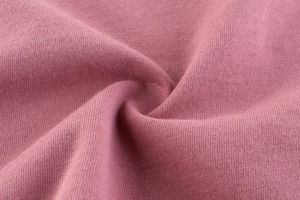 Primer plano de tela de punto de alta calidad en un elegante color rosa viejo