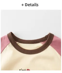 Détails des manches raglan et col côtelé sur le t-shirt enfant imprimé éléphant