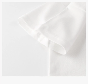 Detail of white cotton T-shirt sleeve showing premium stitching and fabric texture