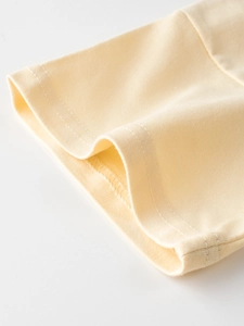Short sleeve kids T-shirt in cream yellow with professional double needle stitching detail