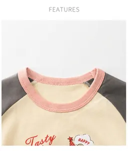Close-up of kids cotton T-shirt featuring a pink ribbed collar and happy chef print