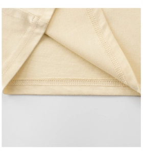 Close-up of double-needle stitching on children's cotton tee with fine knit texture