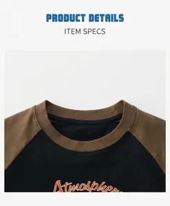 Detail display of the cotton crewneck collar and raglan sleeve seams on kids t-shirt