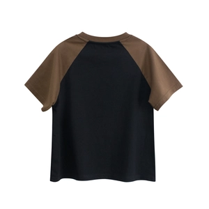 Detailed view of kids cotton t-shirt with black body and brown raglan sleeves