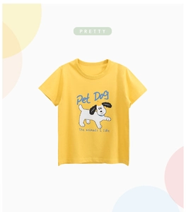Detail of yellow cotton kids T-shirt featuring a playful cartoon white dog print and text