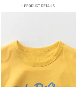 Detail of yellow cotton kids t-shirt showing ribbed neckline and blue cursive print