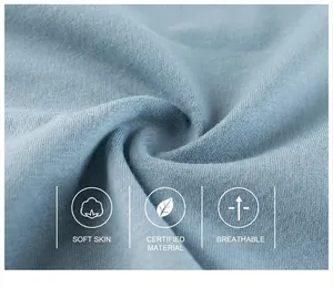 Macro detail of breathable light blue cotton knit fabric showing soft texture and fine weave