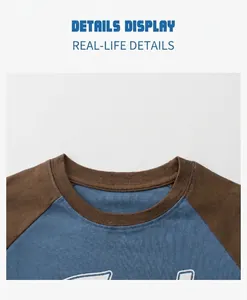 Close-up of the ribbed crew neck and raglan sleeve stitching on the kids cotton T-shirt