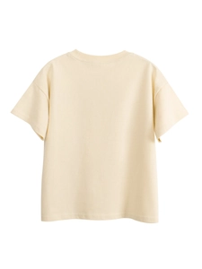 T-shirt en coton crème pour enfants avec un design arrière minimaliste et une coupe ample