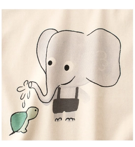 Detail of cartoon elephant and turtle print on cream cotton knitted girls' T-shirt