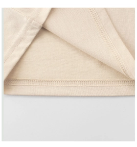 Detailed view of fine stitching and hemline on soft cotton girls' t-shirt
