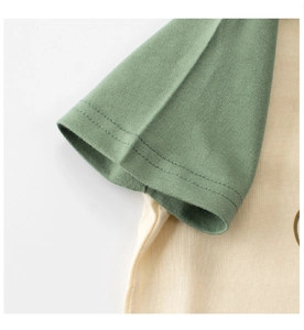 Close-up of contrast short sleeve stitching on cotton knit T-shirt for children