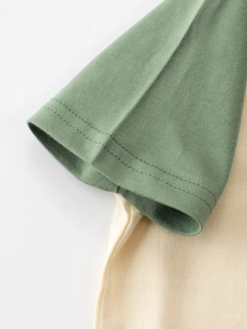 Kids cotton t-shirt with sage green raglan sleeves and neat double-needle stitching