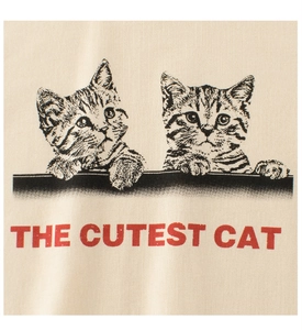 Close-up of girls' cotton T-shirt featuring two cats and THE CUTEST CAT red text
