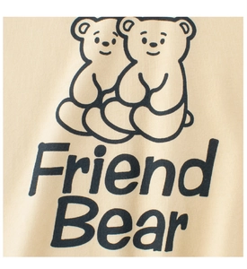 Detail of soft beige cotton fabric featuring a cute twin bear print and Friend Bear text
