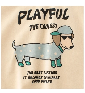 Detailed close-up of a cartoon dachshund print on a beige cotton kids t-shirt fabric