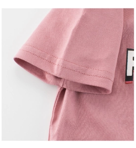 Detail of pink cotton T-shirt featuring double-stitch cuffs and a rubber-printed R logo