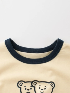 Kids cotton short sleeve T-shirt with navy ribbed neckline and cartoon bear print