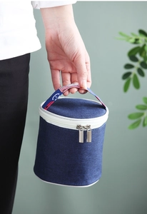 Close-up of a blue thermal soup cup bag with nautical stripes and a zipper closure