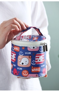 Close-up of insulated ocean-themed soup cup bag with whale patterns and sturdy handle