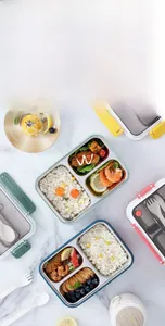 Detail view of SUS304 stainless steel lunch box compartments with meal prep food