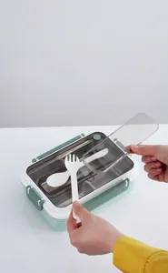 Top view of divided 304 stainless steel bento box with built-in cutlery storage