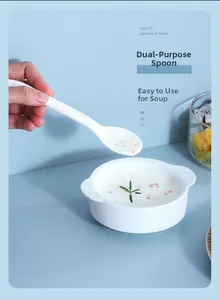 Close-up of a white multi-purpose soup spoon made of food-grade resin for daily dining