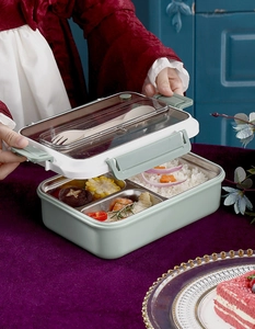 Detail of 304 stainless steel interior compartments and utensils in green bento box