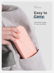 Portable pink cutlery box with geometric design shown fitting easily into a pocket