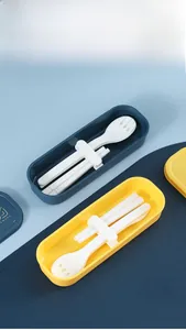 Detail view of portable cutlery set with fork, spoon, chopsticks and storage box