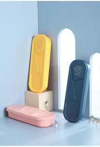 Close-up of portable plastic tableware boxes with geometric patterns in three colors