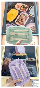 Vista de fiambreras bento de plástico verde menta y lila con juegos de cubiertos y tapas